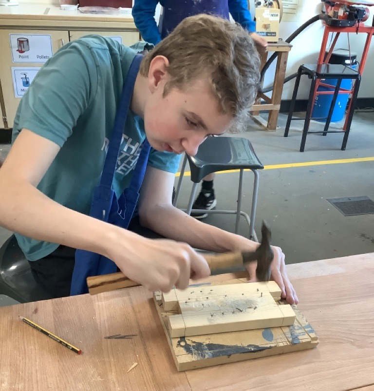 Student working with wood
